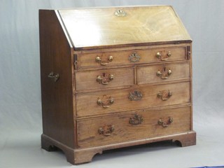 A Georgian mahogany bureau, the fall front revealing a well fitted interior above 1 long, 2 short and 2 long drawers with brass swan neck drop handles, raised on bracket feet 38"