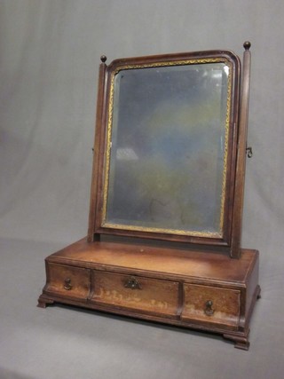 A Georgian rectangular bevelled plate dressing mirror in a mahogany swing frame, the base fitted 1 long and 2 short drawers, raised on ogee bracket feet 18"