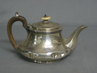 A circular silver teapot, marks rubbed, heavily dented 15 ozs