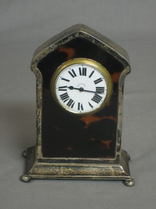 A handsome tortoiseshell and silver mounted 8 day travelling clock with enamelled dial and Roman numerals, Chester 1917