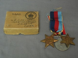 A group of 3 medals comprising 1939-45 Star, Italy Star and British War medal to E T Hayward with original cardboard box