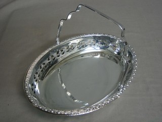 2 oval pierced silver plated cake baskets with swing handles
