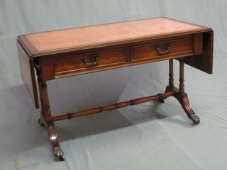 A miniature Georgian style sofa table with red inset writing surface, the base fitted 2 long drawers 37"