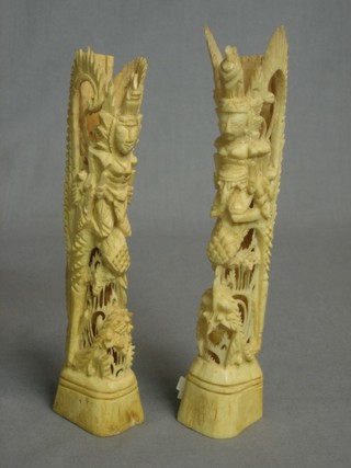 2 Oriental pierced carved sections of bone decorated mythical figures