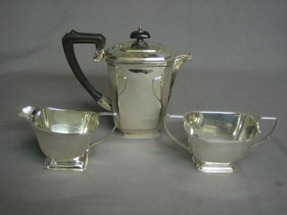 An Art Deco rectangular silver plated coffee pot with matching sugar bowl and cream jug