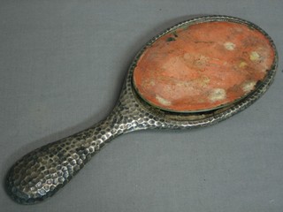 An oval embossed silver backed hand mirror