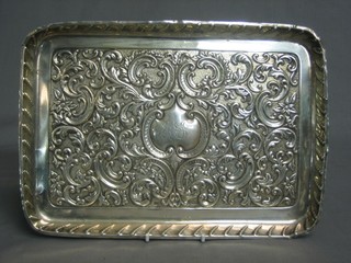 An Edwardian rectangular embossed silver dressing table tray, London 1901 9 ozs