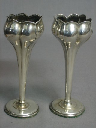 A pair of Edwardian shaped silver specimen vases raised on circular spreading feet, marks rubbed 6"