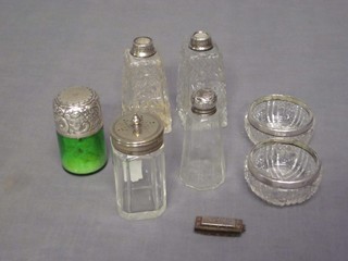 A green glass salt bottle with silver lid, 2 cut glass salts with silver bands, 2 dressing table bottles and a miniature Hohner mouth organ