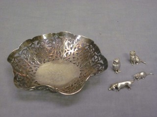 A circular pierced silver plated bowl and 4 white metal figures of animals