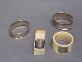 2 silver napkin rings, a bone napkin ring and a metal thimble