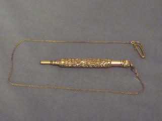 A gilt cased propelling pencil hung on a gilt chain