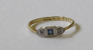A lady's 18ct gold dress ring set a blue stone surrounded by diamonds