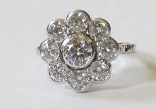 A lady's 18ct white gold cluster dress ring set 9 diamonds, approx 1.90ct