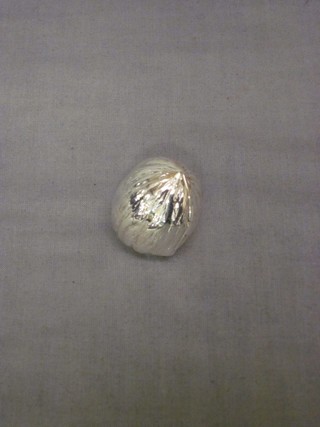 A modern silver trinket box in the form of a walnut