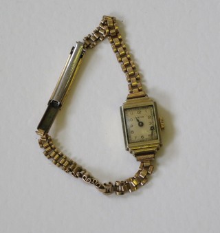 A lady's wristwatch contained in a gold plated case
