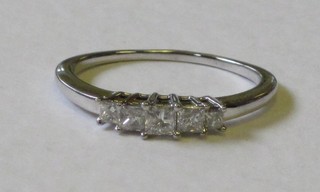 A lady's 18ct white gold dress ring set 5 diamonds