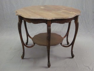 An Edwardian circular  occasional table with undertier raised on 6 cabriole supports 42"