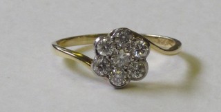 A lady's 18ct white gold cluster dress ring set numerous diamonds, approx 0.50ct