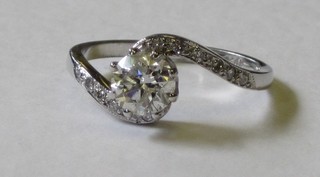A lady's 18ct white gold solitaire diamond engagement/dress ring, the shoulders set diamonds, approx 0.90/0.10ct