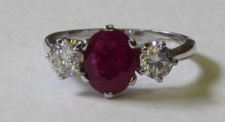 A lady's 18ct white gold dress ring set a ruby and 2 diamonds approx 0.75/1.98ct 