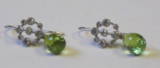 A pair of Peridot and diamond earrings