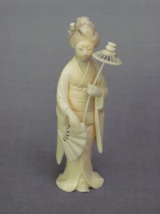 A carved ivory figure of a standing Geisha girl 4 1/2"