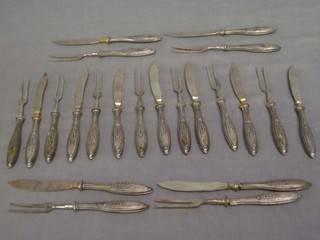 A quantity of Continental "silver" handled fruit knives and forks