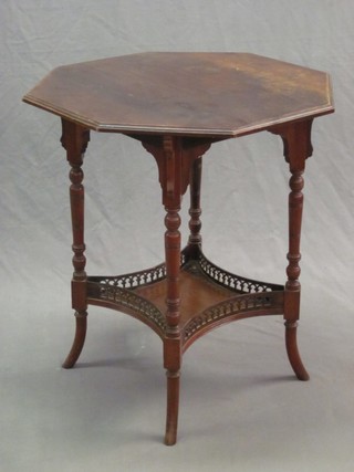 An Edwardian octagonal occasional table with pierced gallery and shaped undertier, raised on outswept supports 24" 