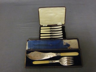A pair of silver plated fish servers with ivory handles and 6 silver plated tea knives, cased