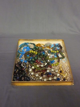 A collection of beads and costume jewellery etc