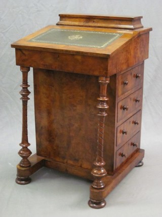 A Victorian walnut Davenport, the top with hinged stationery box the pedestal fitted 4 long drawers raised on turned supports 20"