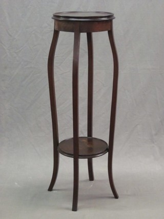 A circular mahogany 2 tier jardiniere stand raised on cabriole supports 12"