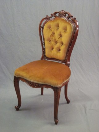 A Continental mahogany pierced show frame chair with upholstered seat and back, raised on cabriole supports