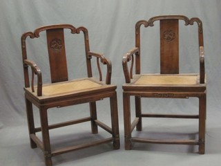 A pair of 19th Century bleached Eastern hardwood throne chairs, raised on square supports