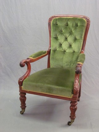 A William IV mahogany show frame open arm chair upholstered in green material and raised on turned and fluted supports