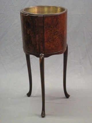 A 1920's circular walnut planter complete with metal line, raised on cabriole supports 13"