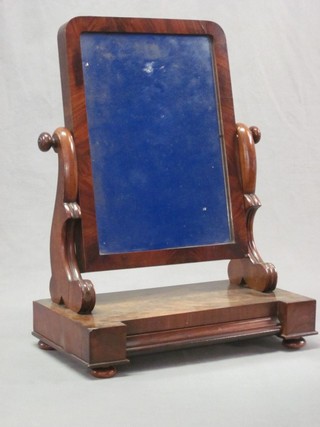 A Victorian rectangular plate dressing table mirror contained in a mahogany swing frame 15"