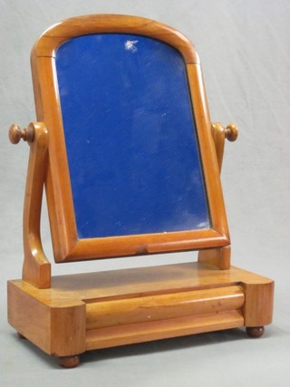 A 19th Century arched plate dressing table mirror contained in a bleached mahogany frame, the base fitted a drawer 15 1/2"