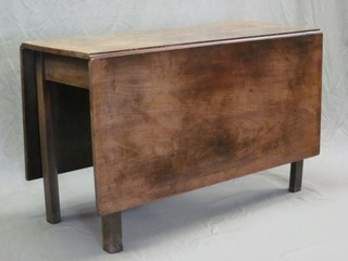 A Georgian mahogany drop flap gateleg dining table, raised on square supports 45"