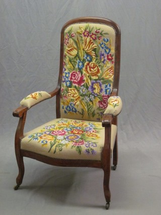 A 19th Century Continental walnut open arm chair, with upholstered Berlin wool work seat and back (some worm)