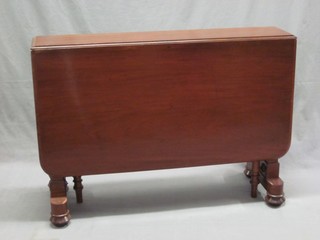 A Victorian mahogany oval drop flap gateleg dining table, raised on standard end supports 42"