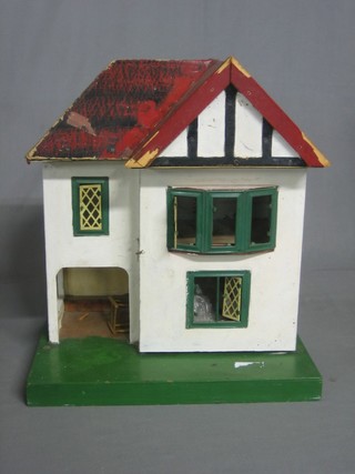 A wooden painted model dolls house 15"