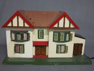 A wooden painted dolls house 28 1/2"