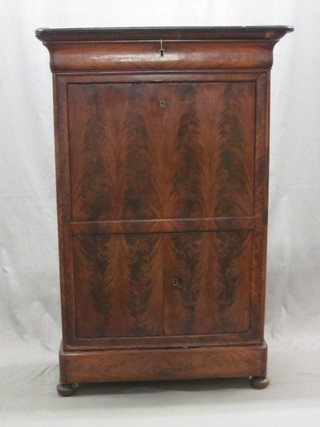 A Biedermeire style escritoire with black veined marble top, fitted a secret drawer, the fall front revealing a well fitted interior, the base fitted a cupboard enclosed by a panelled door 38"