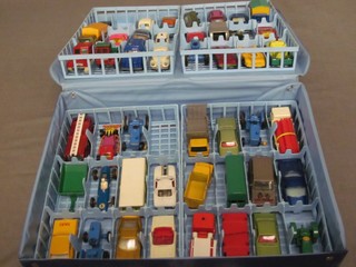 A collection of Matchbox series cars contained in a plastic carrying case