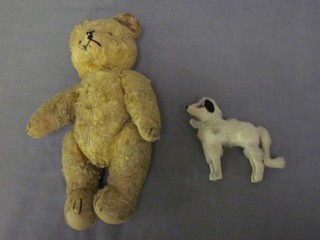 A yellow teddybear with articulated limbs 8" together with a small furry figure of a dog 3"