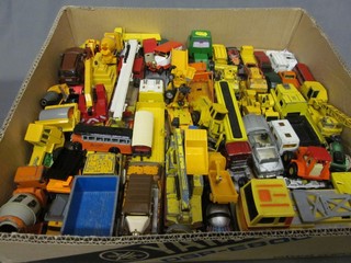 A collection of various model bulldozers, trucks, lorries etc