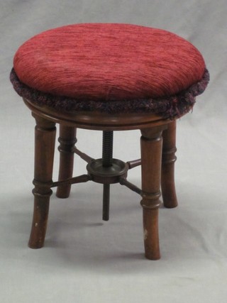 A William IV circular mahogany revolving adjustable piano stool