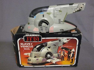 A Return of The Jedi Slave 1 vehicle boxed and a figure of frozen Hans Solo, boxed
